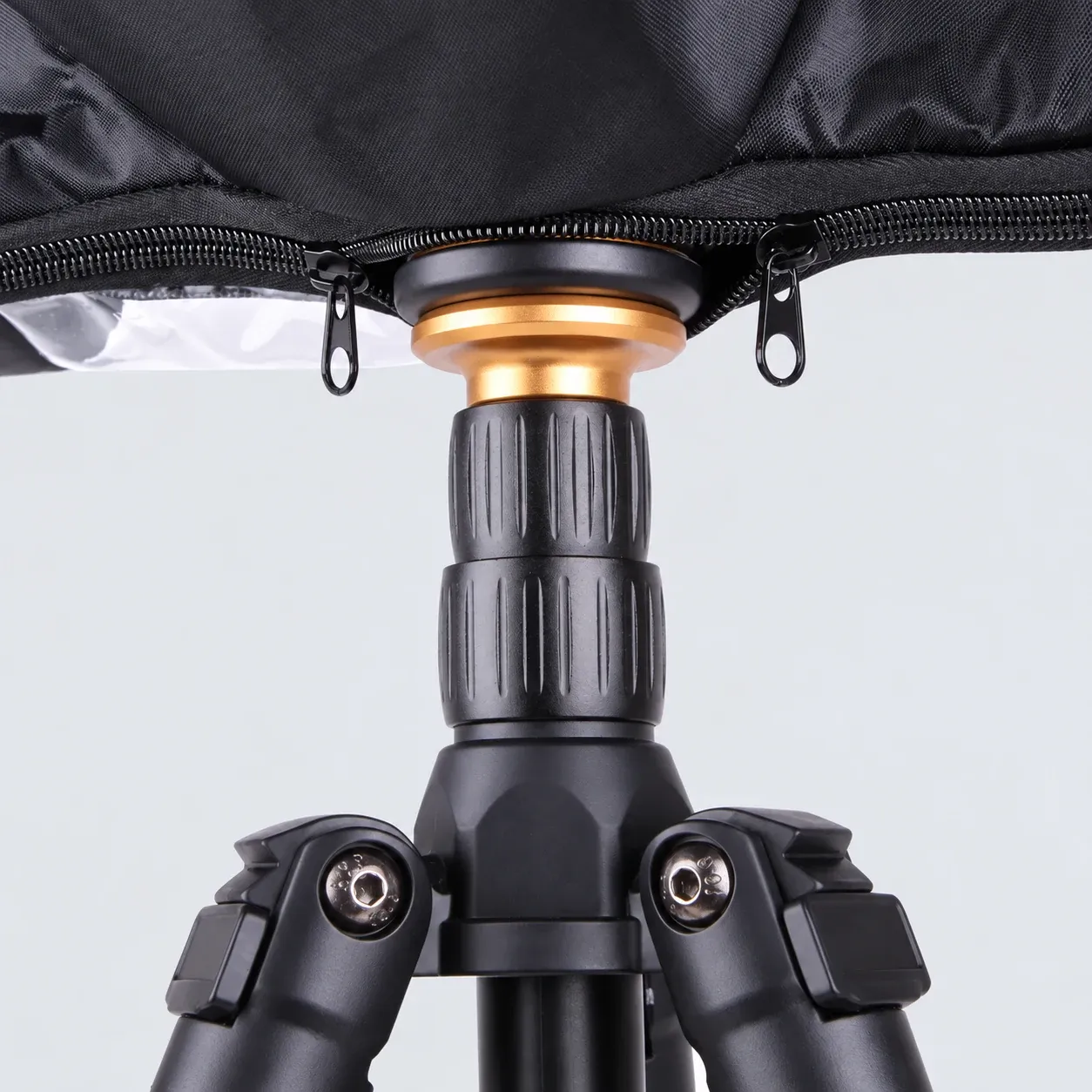 Double zipper opening beneath the cover; tripod is not included